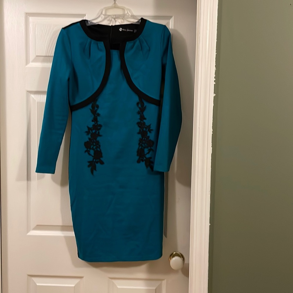 Emerald green and black dress.